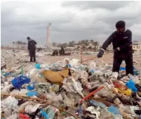  ?? Reuters ?? Workers clean a shore from garbage in the Zouk Mosbeh municipali­ty are in Lebanon. —