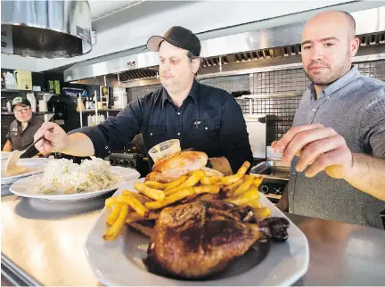  ?? PHOTOS: GIOVANNI CAPRIOTTI/MONTREAL GAZETTE ?? Co-owners, from right, Stefano Faita, Michele Forgione and Yann Turcotte prepare to taste the roasted chicken platter that will be served at Chez Tousignant when it opens in November.