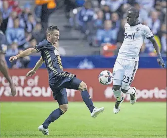 ?? [DARRYL DYCK/THE CANADIAN PRESS] ?? Kekuta Manneh, right, scored 22 goals in 101 appearance­s for the Whitecaps.