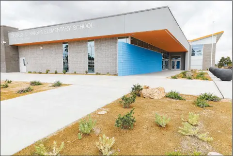  ?? PHOTOS BY YASMINA CHAVEZ ?? An exterior view shows the entrance to the newly rebuilt George E. Harris Elementary School in east Las Vegas. Harris Elementary was one of a handful of CCSD grade schools in older Las Vegas neighborho­ods that was torn down and rebuilt. The school will welcome students back to campus next week.