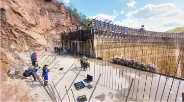  ?? ?? Workmen construct the wall of Lake Gwayi Shangani yesterday . A 245km pipeline is being laid to end Bulawayo’ s perennial water woes.— Picture: Eliah Saushoma