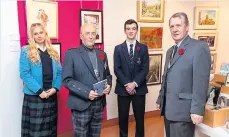  ?? ?? Talented Pictured from left, S4-S6 age group winner Kim Paul from Glenalmond; Iain Dunsire, president of Perthshire Art Associatio­n; S1-S3 winner Reuben LaVallee from Strathalla­n and Brian Johnstone, president of Rotary Club of Perth Kinnoull. Pic: Richard Wilkins