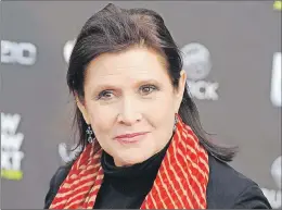  ?? AP PHOTO ?? This file photo shows Carrie Fisher at the 2011 Newnownext Awards in Los Angeles. A coroner’s report released on Monday shows Fisher had cocaine, ecstasy and heroin in her system when she became ill on a London to Los Angeles flight in December.