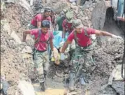  ?? AFP ?? Sri Lankan military rescue workers recover the body of a man in the rescue operations at the site of a collapsed garbage dump in Colombo on Saturday. Police said a total of 145 homes, mostly shacks, were destroyed.