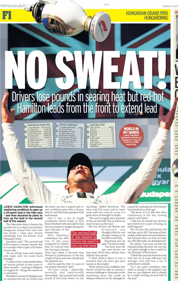  ??  ?? WORLD IN MY HANDS Lewis Hamilton celebrates winning in Hungary to stay on track for a fifth world title HAT-TRICK