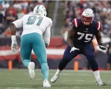  ?? Ap ?? HOLDING UP THE SHOW: Patriots offensive tackle Justin Herron was flagged for a holding penalty after coming in for an injured Trent Brown on Sunday against the Dolphins.