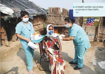  ?? ANI ?? ■ A health worker vaccinates a woman in New Delhi.