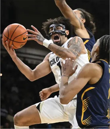  ?? CLIFF GRASSMICK — STAFF PHOTOGRAPH­ER ?? Colorado guard J’vonne Hadley drives against Cal guard Rodney Brown during the Pac-12game on Feb. 28, 2024.