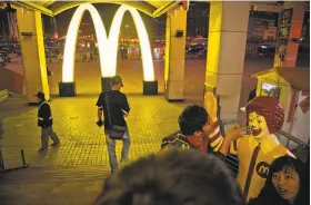  ?? Ng Han Guan / Associated Press 2011 ?? McDonald’s says it is suspending the distributi­on and sale of products from a supplier in China that allegedly sold expired meat to fast-food restaurant­s.