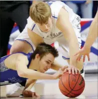  ?? FILE PHOTO ?? Shirley’s Joseph Owen, bottom, and Guy-Perkins’ Daniel Dorado scramble for a loose ball during the Class 1A state-championsh­ip game March 11 in Hot Springs.