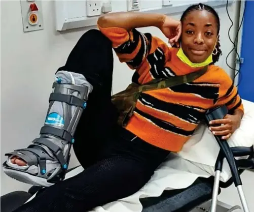  ?? ?? Sole survivor: AJ Odudu, with crutches on a hospital bed, even asked doctors if she could dance in her medical boot