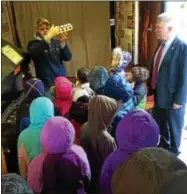  ?? SUBMITTED PHOTO ?? Vernon-Verona-Sherrill FFA President Jonathan Perry displays a maple grading kit to elementary students from East Syracuse as NYS Assemblyma­n Mark Johns observes the process.