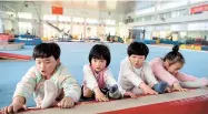  ??  ?? Gymnasts as young as 4 stretch at the Li Xiaoshuang Gymnastics School in Xiantao in China’s Hubei Province. — AFP