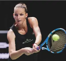  ?? AP ?? Karolina Pliskova hits a double-fisted backhand return to fellow Czech Petra Kvitova during their match at the WTA Finals in Singapore yesterday.