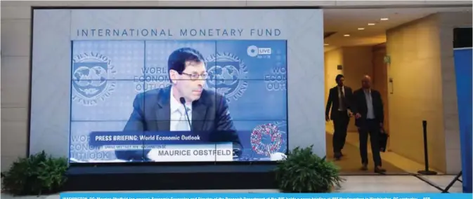  ??  ?? WASHINGTON, DC: Maurice Obstfeld (on screen), Economic Counselor and Director of the Research Department at the IMF, holds a press briefing at IMF Headquarte­rs in Washington, DC yesterday.