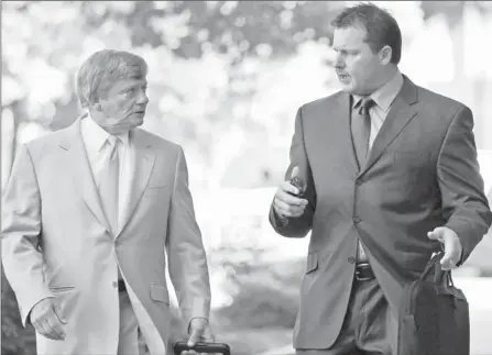  ?? By Alex Brandon, AP ?? In July: Roger Clemens, right, and attorney Rusty Hardin outside federal court. Clemens’ first trial was halted when banned evidence was introduced.