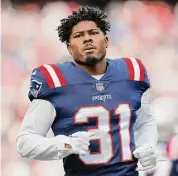  ?? Michael Dwyer/Associated Press ?? New England Patriots cornerback Jonathan Jones is shown prior to a game on Jan. 1 in Foxborough, Mass. The Patriots have taken a step toward maintainin­g some stability in their secondary, agreeing to terms on a new contract to retain free agent Jones.