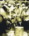  ?? PTI ?? Farmers pour milk on a road during a protest in Ahmednagar, Maharashtr­a