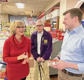  ?? ?? Margaret Mazur, left, owner of Polmart, a Polish grocery in New Britain, talks with state Comptrolle­r Sean Scanlon, right, and state Rep. Peter Tercyak, D-New Britain, March 17.