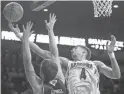  ?? MAMTA POPAT/ARIZONA DAILY STAR ?? Arizona’s Chase Jeter (4) goes up for a rebound against Utah Valley’s Wyatt Lowell.