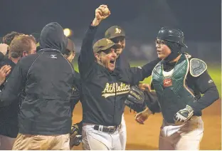  ?? JASON MALLOY/THE GUARDIAN ?? The Alley Stratford Athletics second baseman Allister Smith, second from right, holds up the game ball after making the final play of the 2019 Kings County Baseball League playoffs Sunday in Morell.