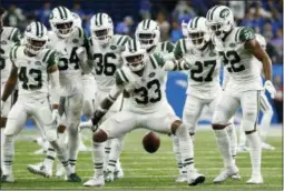  ?? RICK OSENTOSKI — THE ASSOCIATED PRESS ?? New York Jets defensive back Jamal Adams (33) celebrates his intercepti­on with teammates during the second half of an NFL football game against the Detroit Lions in Detroit, Monday.