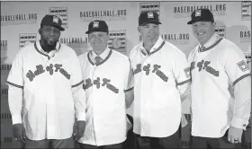  ?? AP Photo/File ?? Baseball Hall of Fame inductees (from left) Vladimir Guerrero, Trevor Hoffman, Chipper Jones and Jim Thome pose during a news conference in New York on Jan. 25.
