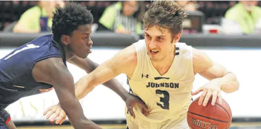  ?? Tom Reel / Staff photograph­er ?? Jaguar point guard Zach Keller moves the ball against Abdikadir Ali during Friday’s game. Keller, a senior guard, finished with 11 points.