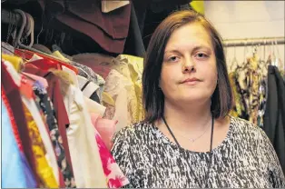  ?? TARA BRADBURY/THE TELEGRAM ?? Amy Edwards is a wardrobe assistant at the St. John’s Arts and Culture Centre. Her job entails working with the thousands of costumes in the centre’s collection, from period costumes to contempora­ry outfits, choosing the perfect pieces for specific...