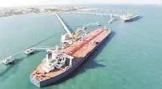  ??  ?? A general view of a crude oil importing port in Qingdao, Shandong province. Indonesian police said yesterday, Interpol has issued red notices, the closest to an internatio­nal arrest warrant, for three Chinese executives suspected of fraud linked to a...