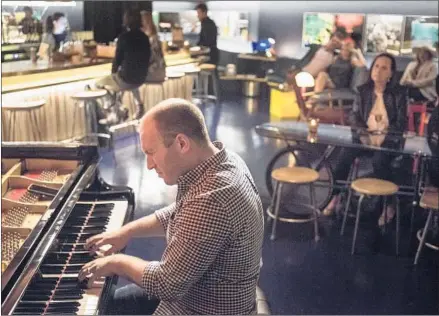  ?? Photograph­s by Nick Agro For The Times ?? MAX HAYMAR performs with his jazz trio last month at the cozy Sam First bar, which boasts “the best club piano in L.A.”