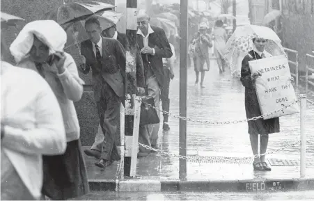  ??  ?? COURAGEOUS: Even in torrential rains members of Black Sash weathered the storm, fighting the injustices of the apartheid government.