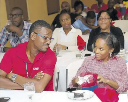  ??  ?? Kevin Richards and Michelle Letts hold talks during a luncheon to recognise the philanthro­pic efforts of the company’s EHS volunteers.