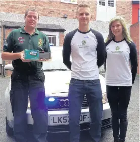  ??  ?? Pictured is Ray Woolley and Harry and Zoe, of Donington Outdoors, with the satnav unit the company provided for him. Donington Outdoors owner James May said: “In my opinion Ray is a local hero giving an amazing service to the area.”