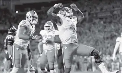  ?? Willie J. Allen Jr., AP ?? Clemson quarterbac­k Deshaun Watson celebrates his touchdown during the second half of the Atlantic Coast Conference championsh­ip against Virginia Tech on Saturday in Orlando, Fla.