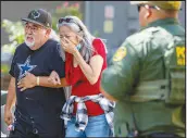  ?? WILLIAM LUTHER / THE SAN ANTONIO EXPRESSNEW­S VIA AP ?? A woman cries Tuesday as she leaves the Uvalde Civic Center in Uvalde, Texas. An 18-year-old gunman opened fire Tuesday at an elementary school in the rural Texas city, killing multiple children and a teacher and wounding others, Gov. Greg Abbott said. The gunman was dead.