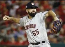  ?? AP PHOTO/PATRICK SEMANSKY ?? Houston Astros starting pitcher Jose Urquidy throws against the Washington Nationals during the first inning of Game 4 of the baseball World Series on Saturday, in Washington.