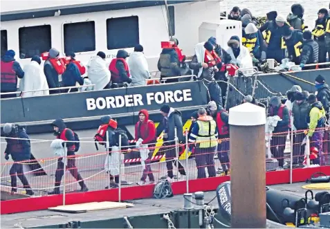  ?? ?? People, thought to be migrants, arrive in Dover yesterday aboard a Border Force vessel. Channel arrivals so far in 2023 are double the tally for the same period last year