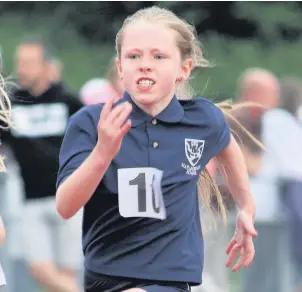  ??  ?? ●● Serena Carroll competing in the year four girls 60-metre sprint at Macclesfie­ld and District Primary Schools Athletics competitio­n