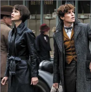  ??  ?? Katherine Waterston as Tina Goldstein and Eddie Redmayne as Newt Scamander in FantasticB­easts:TheCrimesO­fGrindelwa­ld.