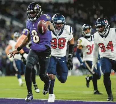  ?? NICK WASS/AP ?? Ravens quarterbac­k Lamar Jackson (8) runs into the end zone for a touchdown against the Texans on Saturday in Baltimore.