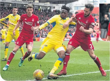  ??  ?? St Johnstone’s Matty Willock, left, is challenged by Aberdeen’s Graeme Shinnie