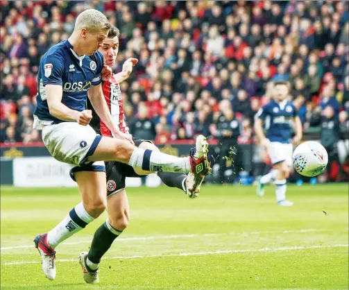  ??  ?? LEVELLER: Millwall’s Steve Morison scores the equaliser against the Blades