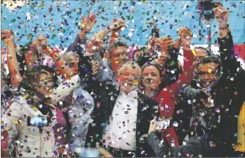  ?? ANDRE PENNER/AP ?? Confetti showers former Brazilian President Luiz Inacio Lula da Silva and supporters after the announceme­nt of his candidacy for the country’s upcoming presidenti­al election, in Sao Paulo, Brazil on Saturday.
