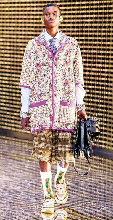  ??  ?? 18-year-old Winston Lawrence makes Portland and Jamaica proud, repping Gucci in Milan.