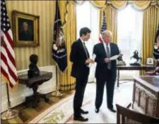  ?? ANDREW HARNIK — THE ASSOCIATED PRESS ?? President Donald Trump speaks to White House Senior Adviser Jared Kushner, left, in the Oval Office in Washington, Friday.