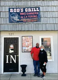  ?? PILOT NEWS GROUP PHOTO / JAMES MASTER ?? Rob Taylor, left, and Jeni Taylor (right) stand in front of their restaurant Rob’s Grill.