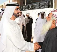 ?? WAM ?? Greeting the elderly Shaikh Mohammad met senior citizens in Fujairah. During the trip the Vice - President ordered the start of constructi­on of three residentia­l compounds valued at Dh1.2 billion, which will be built in the emirates of Ajman, Ras Al...