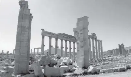  ?? Maher Al Mounes, AFP/Getty Images file ?? The Arch of Triumph, also called the Monumental Arch of Palmyra, was destroyed by Islamic State terrorists in October 2015. The site is in the ancient Syrian city of Palmyra.