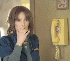  ?? CURTIS BAKER / NETFLIX VIA THE ASSOCIATED PRESS ?? Winona Ryder in a scene from Stranger Things, one of the original shows in which Netflix has invested heavily.